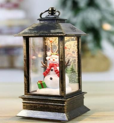 Đèn lồng vàng đồng người tuyết